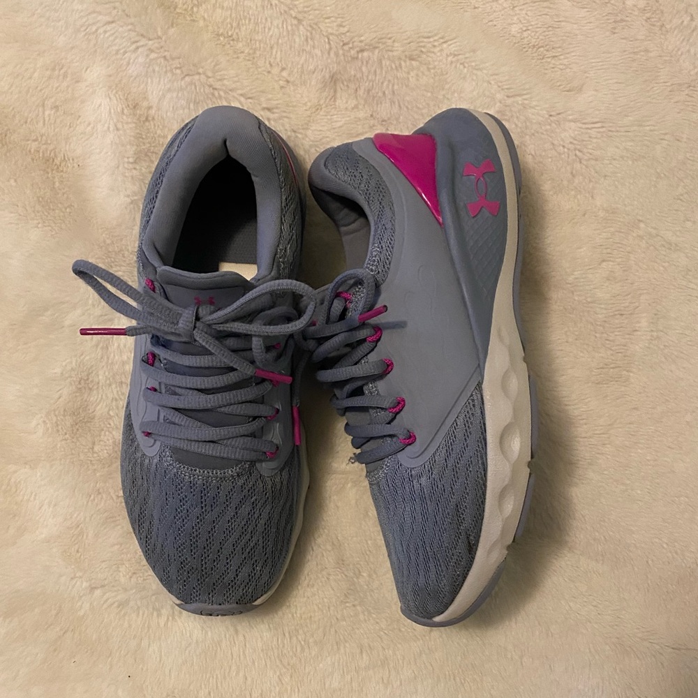 Under Armour girls running shoes in the color light purple size 7